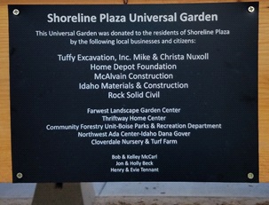 A plaque commemorates the "Shoreline Plaza Universal Garden."